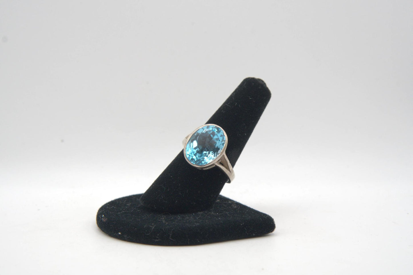 Oval Cut Blue Topaz Bezel Silver Ring